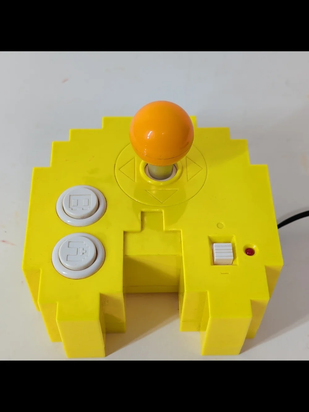 Yellow Retro Arcade Joystick with Orange Ball Top